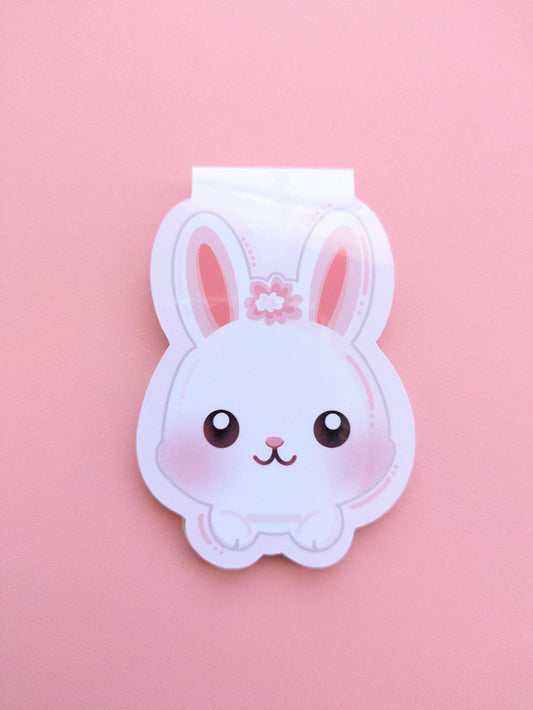 High-quality solo shot of a Marshmallow Blush Bunny magnetic bookmark by Ateu Studio. The vibrant pink and snowball white bunny sits against a matching pink background, designed to elevate a workspace or reading nook through intentional, color focused aesthetics.