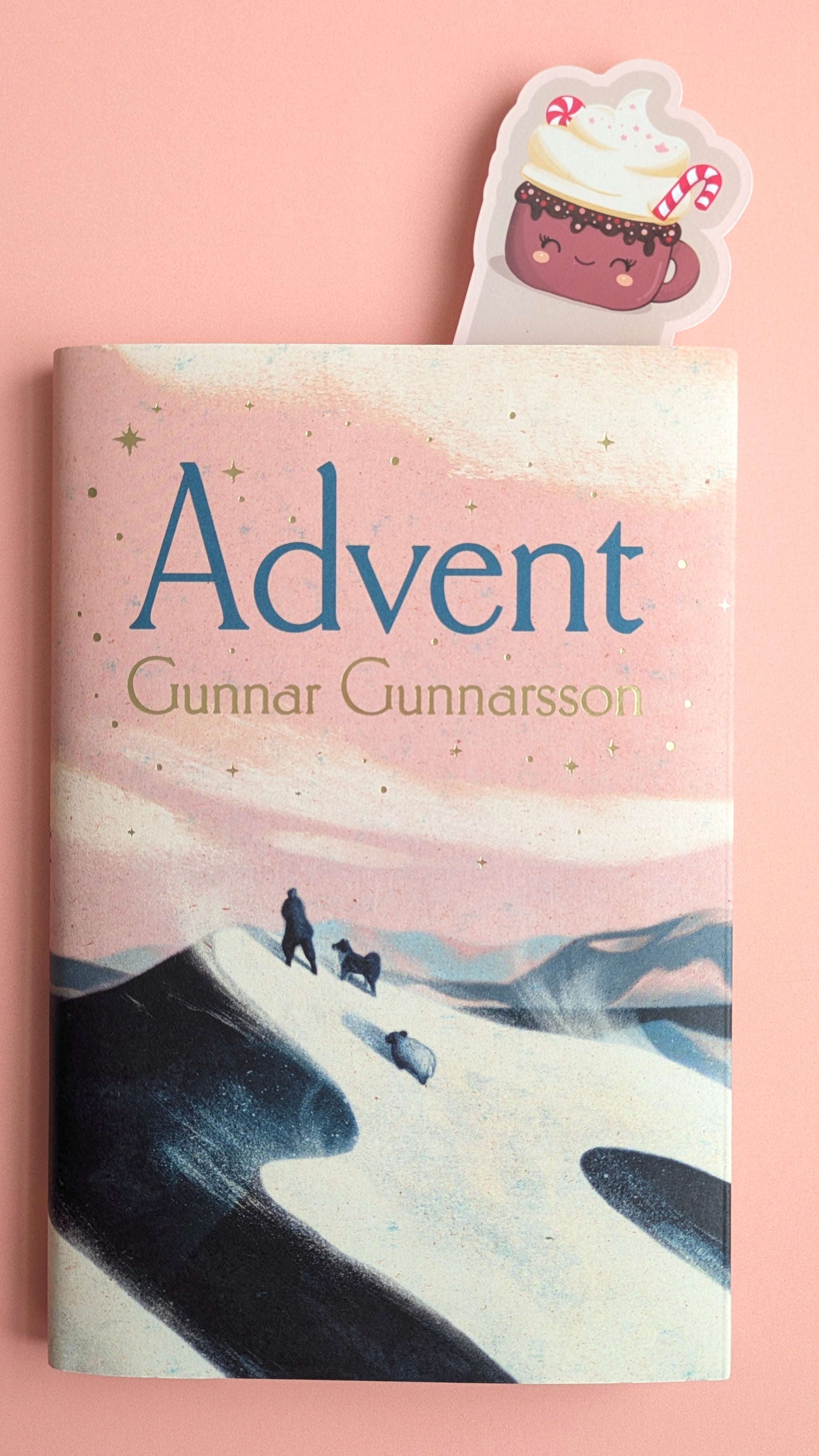 Kawaii peppermint hot chocolate bookmark with soft pink pastel border whipped cream and candy cane — Peppermint Dream holiday design, shown within a book, Advent by Gunnar Gunnarsson, 