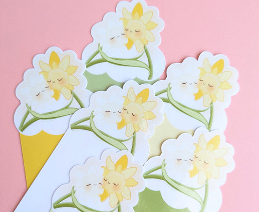 A top-down aerial view of six kawaii Daffodil Hug Szn bookmarks layered in a cluster on a pink background. The shot focuses on the die-cut kawaii daffodil tops and the varying color bases, showcasing the full spring palette for coordinated book decorating.