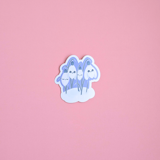 Ateu Studio Sleepy Snowdrop sticker in the 'Midnight Mist' lavender blue colorway, featuring Snowdrop White characters with sage-silver leaves. The cool teal sky palette is shown in an aerial close-up, highlighting the soft-glow effect and quintessential Kawaii faces perfect for winter-themed Kindle decorating.